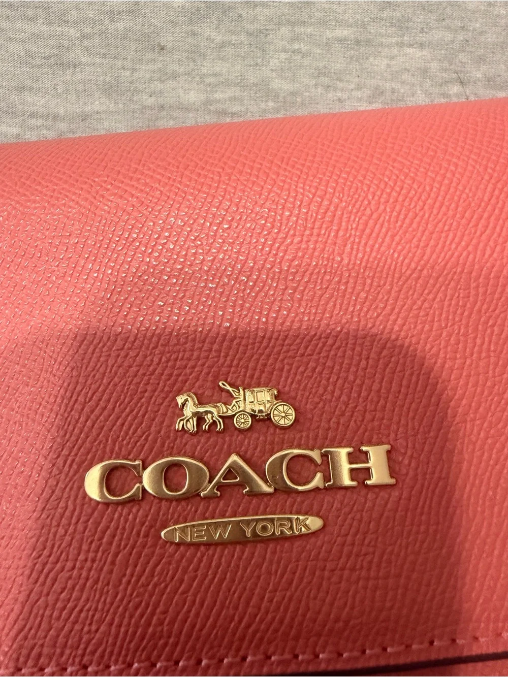 Coach Coral Leather cross body purse with Gold Logo